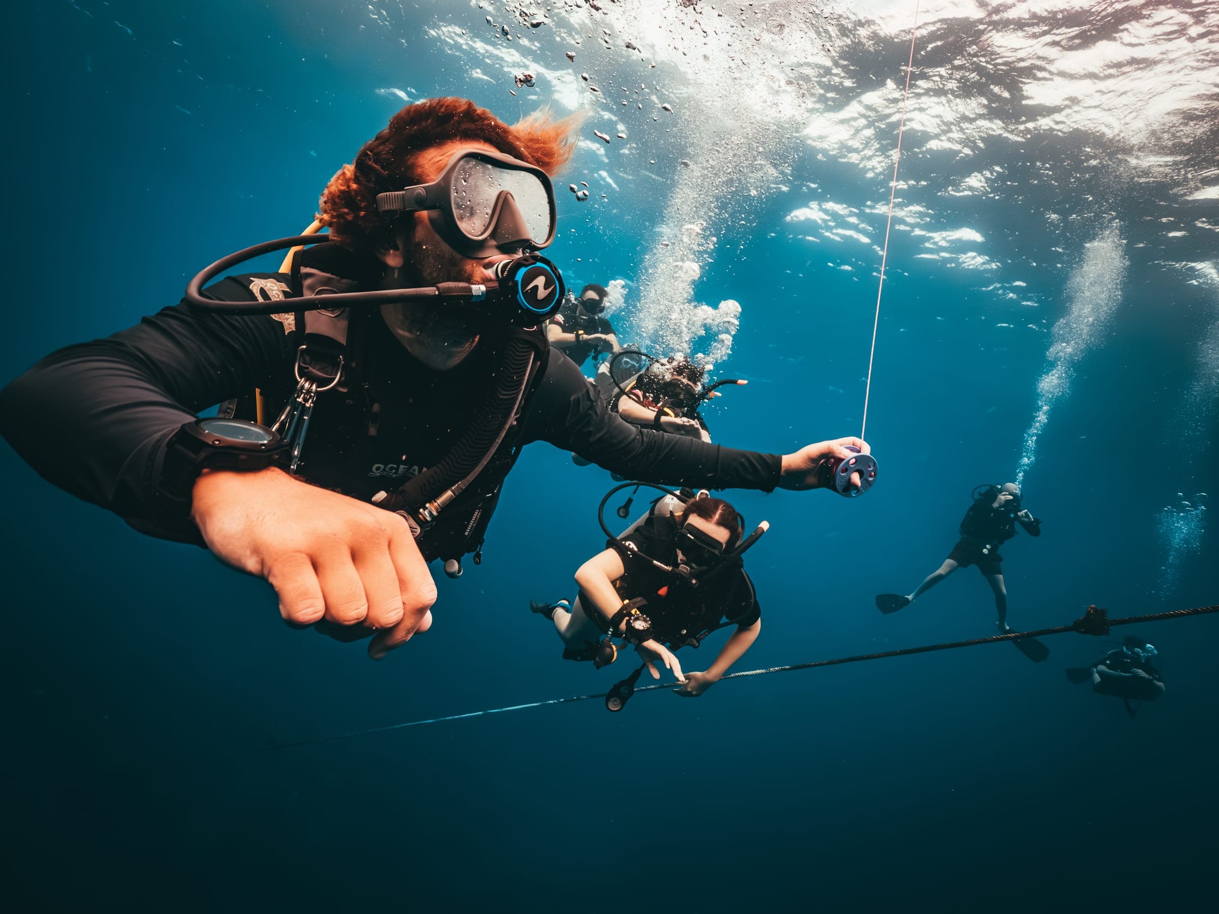 Onyx Divers instructor leading a group dive in Koh Tao